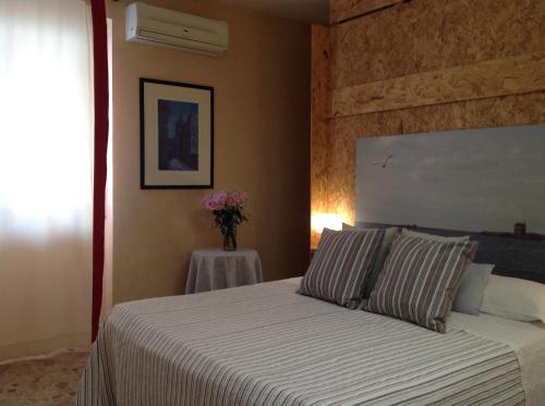 Postel nebo postele na pokoji v ubytování Mare Nostrum Petit Hôtel