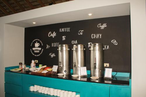 a counter with a black wall with drawings on it at Casa Marina Beach & Reef All Inclusive in Sosúa