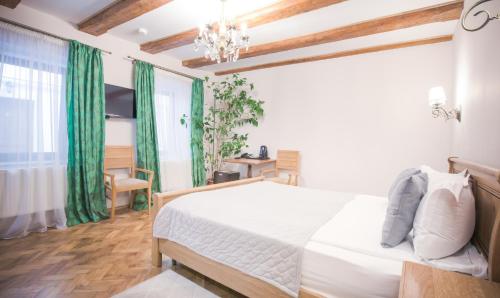 Letto o letti in una camera di Safrano Palace