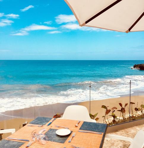 a table with a view of the beach at Casa Marina Beach & Reef All Inclusive in Sosúa