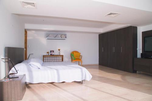 Ein Bett oder Betten in einem Zimmer der Unterkunft Apartamento DUPLEX OCEAN BLUE 1