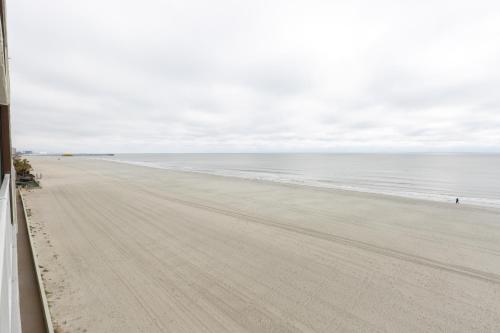 an empty beach with the ocean in the background at Sands Beach Club in Myrtle Beach