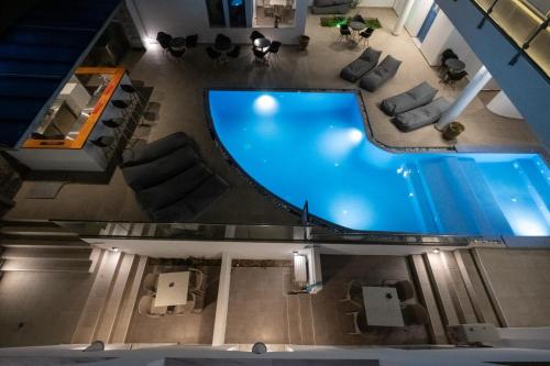 an overhead view of a swimming pool in a building at Tristhenia in Perissa