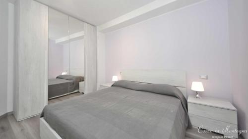 מיטה או מיטות בחדר ב-Ca’ Rina