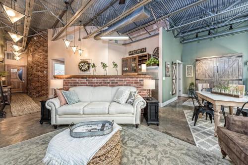 a living room with a couch and a table at Green Door Lofts -Magnolia Loft, Silos/Downtown in Waco
