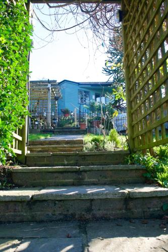 a set of stairs with a wooden fence at Greenfield Lodge in Brighton & Hove