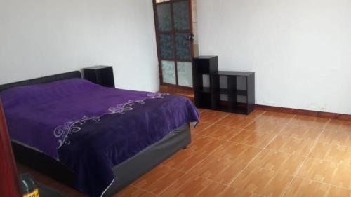 Postel nebo postele na pokoji v ubytování Rancho los Alebrijes Zacatlan