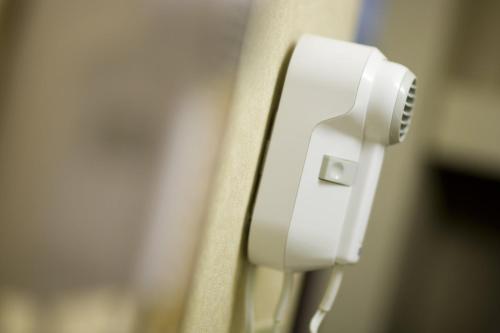 a close up of a white phone on a door at Fairmont Hot Springs Resort in Fairmont Hot Springs