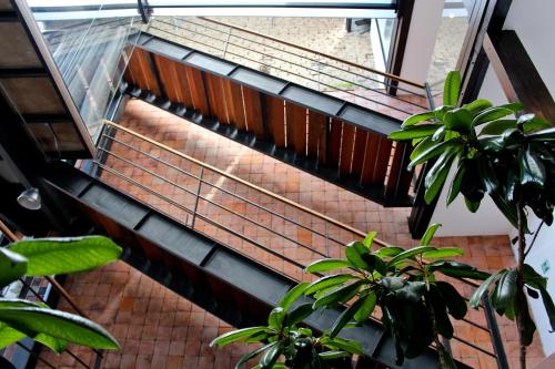 a spiral staircase in a building with a window at Hotel Casa Gardenia in Quito