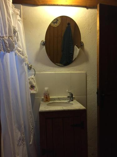 a bathroom with a sink and a mirror at Calafates y lavandas in Chile Chico