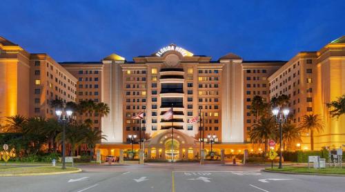 a large building with a street in front of it at The Florida Hotel & Conference Center in the Florida Mall in Orlando
