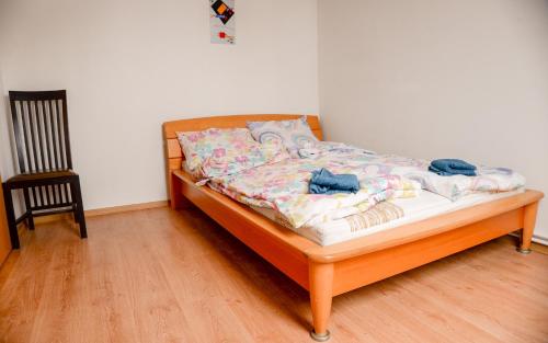A bed or beds in a room at Tacskó Apartment