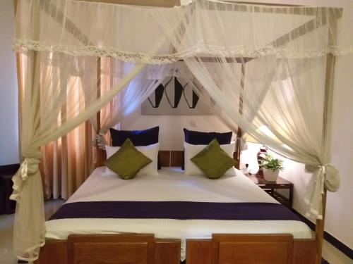 Postel nebo postele na pokoji v ubytování Cosy Nest Home stay