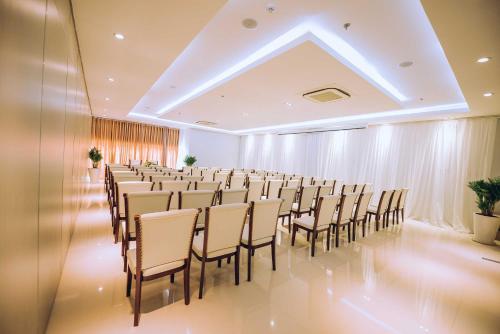 a room with a bunch of chairs in it at Victory Hotel Tây Ninh in Tây Ninh