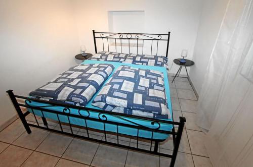 A bed or beds in a room at Appartamento Ca dal Tilo