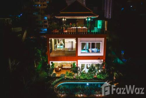 a building with a pool in front of it at night at Private Pool & Jacuzzi Villa, Phratumnak, Pattaya - 600m from the beach, 711 nearby in Pattaya South