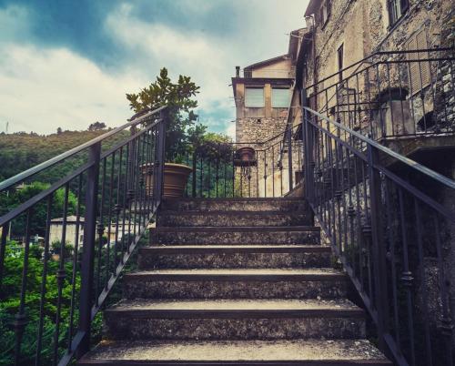 a set of stairs leading up to an old building at La Residenza dei Papi in Papigno