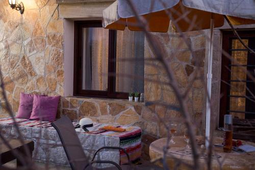 a living room with a couch and a window at Μylos in Kissamos