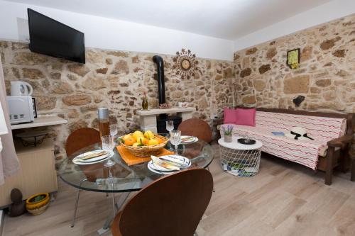 a kitchen with a glass table and chairs in a room at Μylos in Kissamos