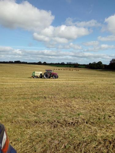 a tractor in the middle of a field at Inny River Lodge in Rathowen