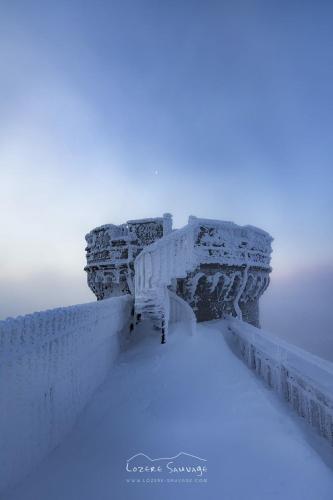 a bridge covered in ice in the snow at Hotel des Etuves in Montpellier