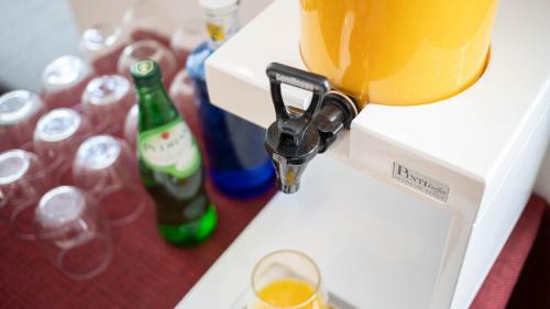 a drink is being poured into a wine glass at Soho Boutique Opera in Madrid
