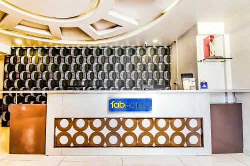 a store front with a large wall of tires at FabHotel Prime Sanket Inn, Phoenix Mall in Pune