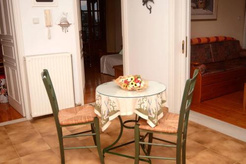 a table and chairs with a cake on top of it at Ancient Olympia Luxury Pool Villa Palace 4Bedroom in Olympia