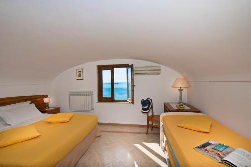 Säng eller sängar i ett rum på Residence Lì Galli