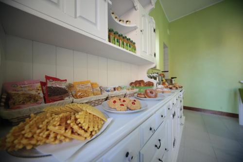 a counter with many plates of food on it at Relais del borgo in Guardiagrele