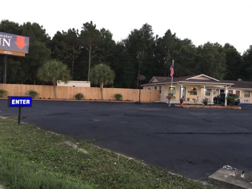 an empty parking lot in front of a motel at Blackwater Inn Milton in Milton