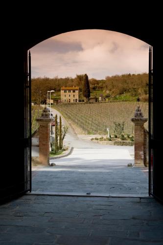 an open door to a driveway with at Castel Monastero - The Leading Hotels of the World in Castelnuovo Berardenga