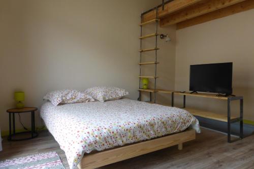 La maison du Plo tesisinde bir odada yatak veya yataklar