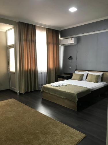 Postel nebo postele na pokoji v ubytování ORIENT