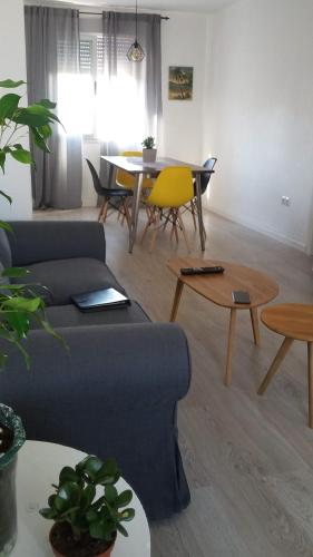 a living room with a couch and a table at Prado Design Apartment in Gandía