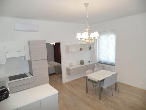 a kitchen and dining room with a table and a dining room at Residenza Vittorio Emanuele in Gorizia