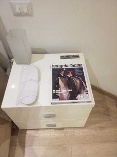 a white box with a magazine on top of it at Ponte della musica Teatro Olimpico in Rome