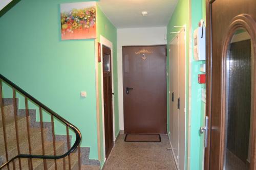 a hallway with a staircase with a door and a hallway at Apartment Holiday Lungötz in Annaberg im Lammertal