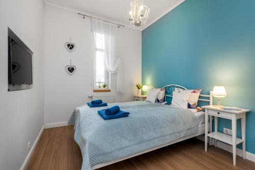 
Łóżko lub łóżka w pokoju w obiekcie Apartamenty Black&White - Apartament Royal
