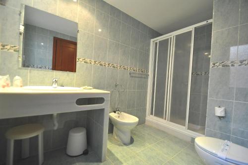 a bathroom with a sink and a toilet at Hotel Goya in Almuñécar