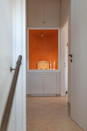 a hallway with a room with a box in it at Nostalgia Seaview House in Anavyssos