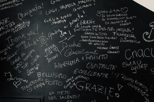 a blackboard with writing on it with a lot of handwriting at Le Stanze Di Brando E Nico in Tricase