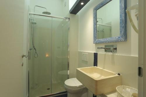 a bathroom with a shower and a sink and a toilet at Le Stanze Di Brando E Nico in Tricase