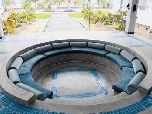a circular pool in the middle of a building at 123 Ocean Front Condo in Nilaveli