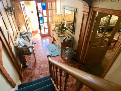 an overhead view of a staircase in a house at The Suites At Ty Anne in Beaumaris