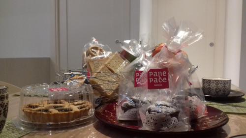 a table with a bunch of desserts in plastic bags at LAMIA MATERA 11 in Matera