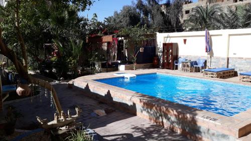 The swimming pool at or near Villa Bahri Luxor Apartment