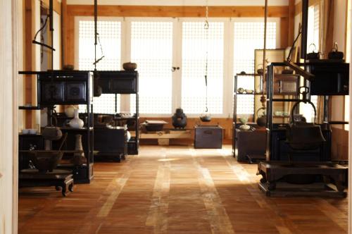 a room with a large window and a wooden floor at Korean Traditional House - Chungnokdang in Boseong