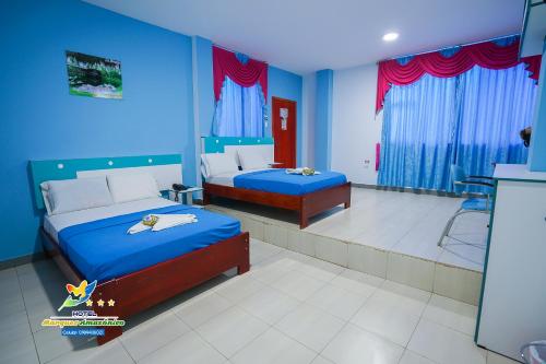 Postel nebo postele na pokoji v ubytování Hotel Marques Amazonico