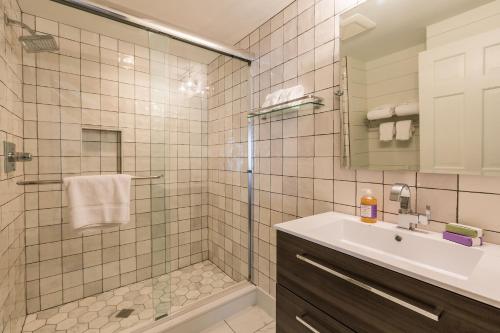 a bathroom with a shower and a sink at The Barnstead Inn in Manchester Center
